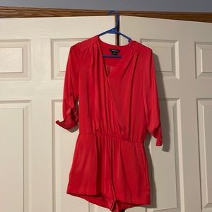 Red romper in satin like material